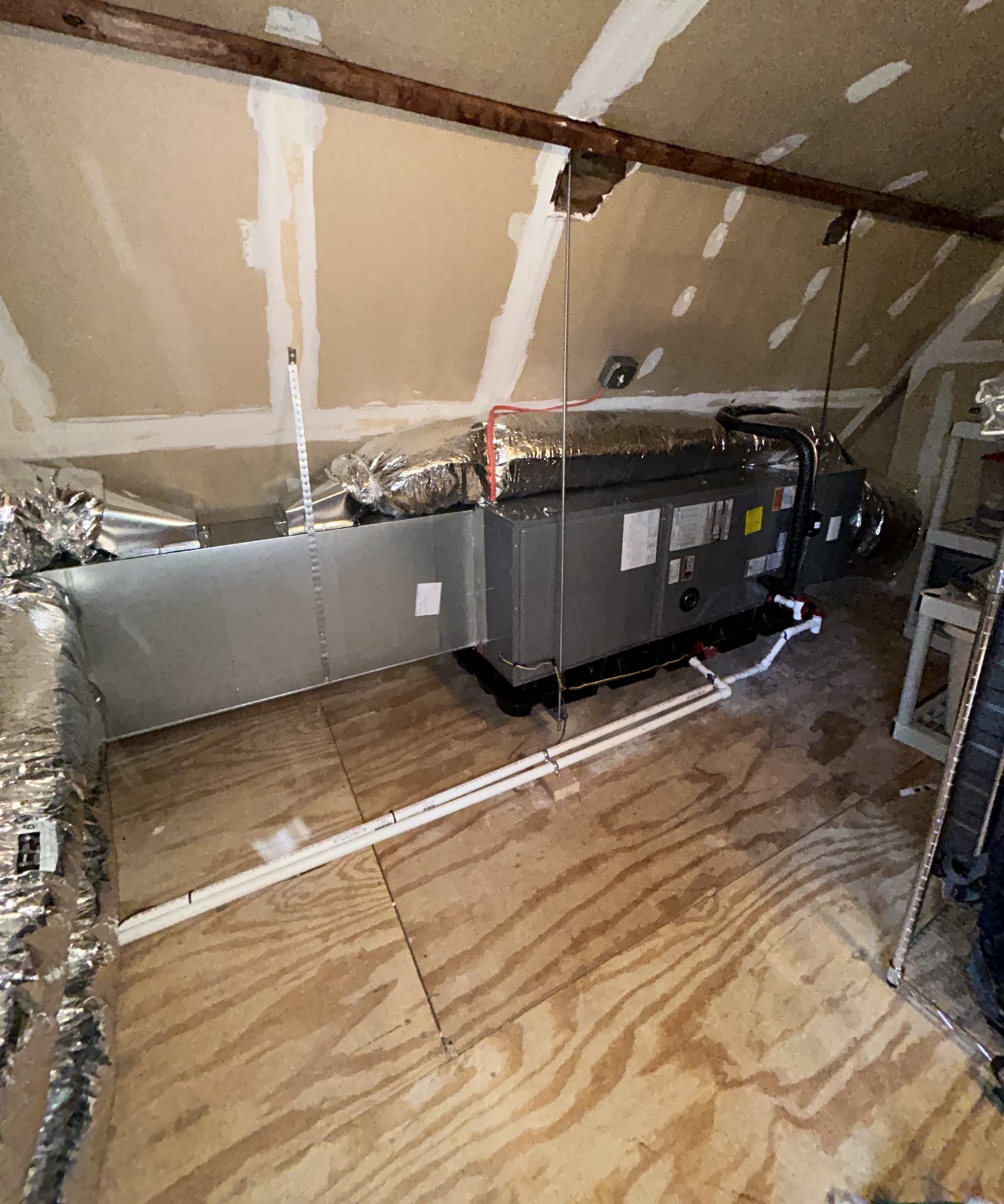 Oil-fired boiler heating system installed in a basement with copper piping, multiple circulator pumps, an expansion tank, and a venting system.
